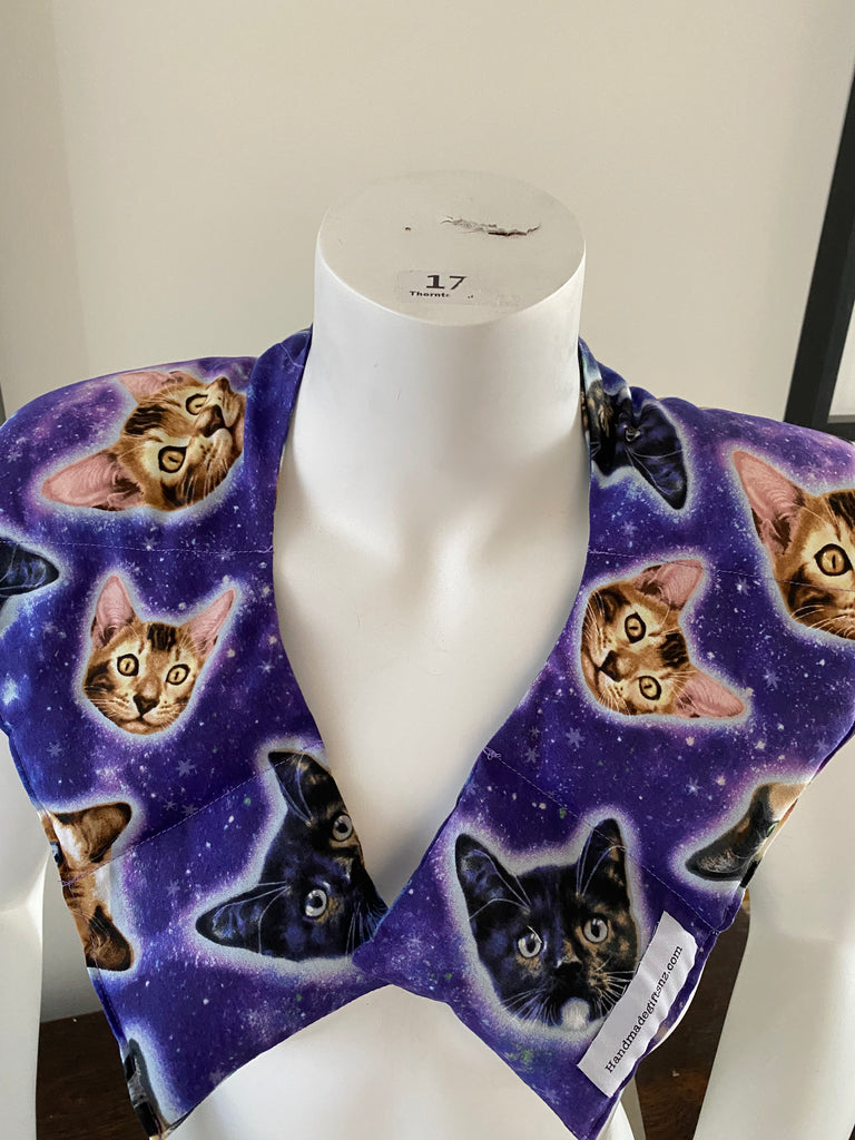 Shoulder Hug Heat Pack soothes sore shoulders. Gorgeous cats print in vibrant tone of purple. Quality cotton fabric.